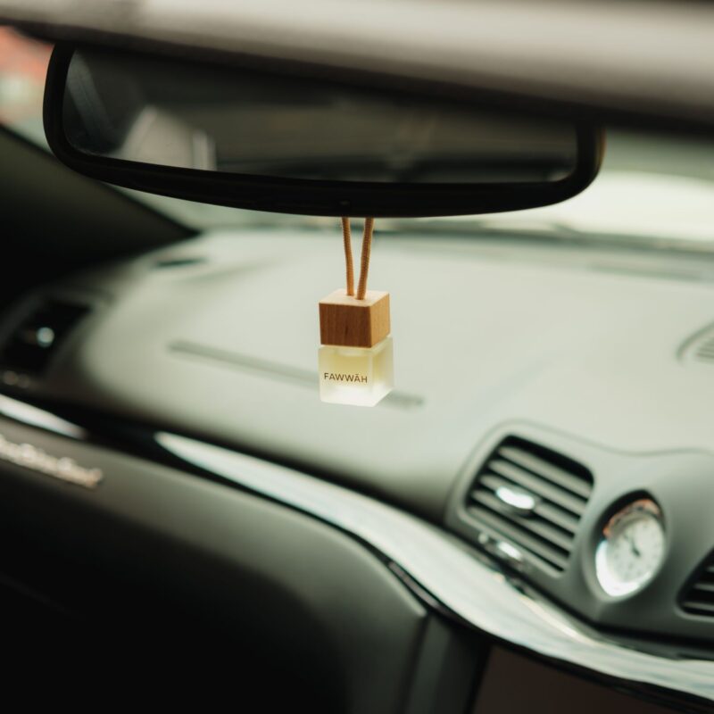 Fragrance car diffuser string setup with packaging in background For him For her Unisex Scented Long Lasting High Quality Made in the UK Maserati BMW Audi Mercedes Porsche Lamborghini Reed Diffuser Perfume Fragrance Stunning Aroma Ambiance Scent Fresh Luxury High Quality Packaging Accessories